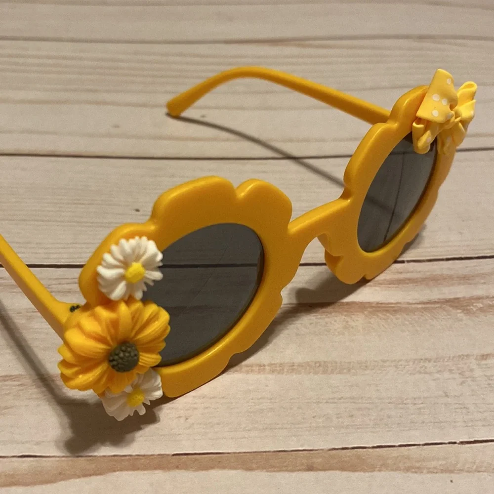 Girls yellow flower shaped sunglasses